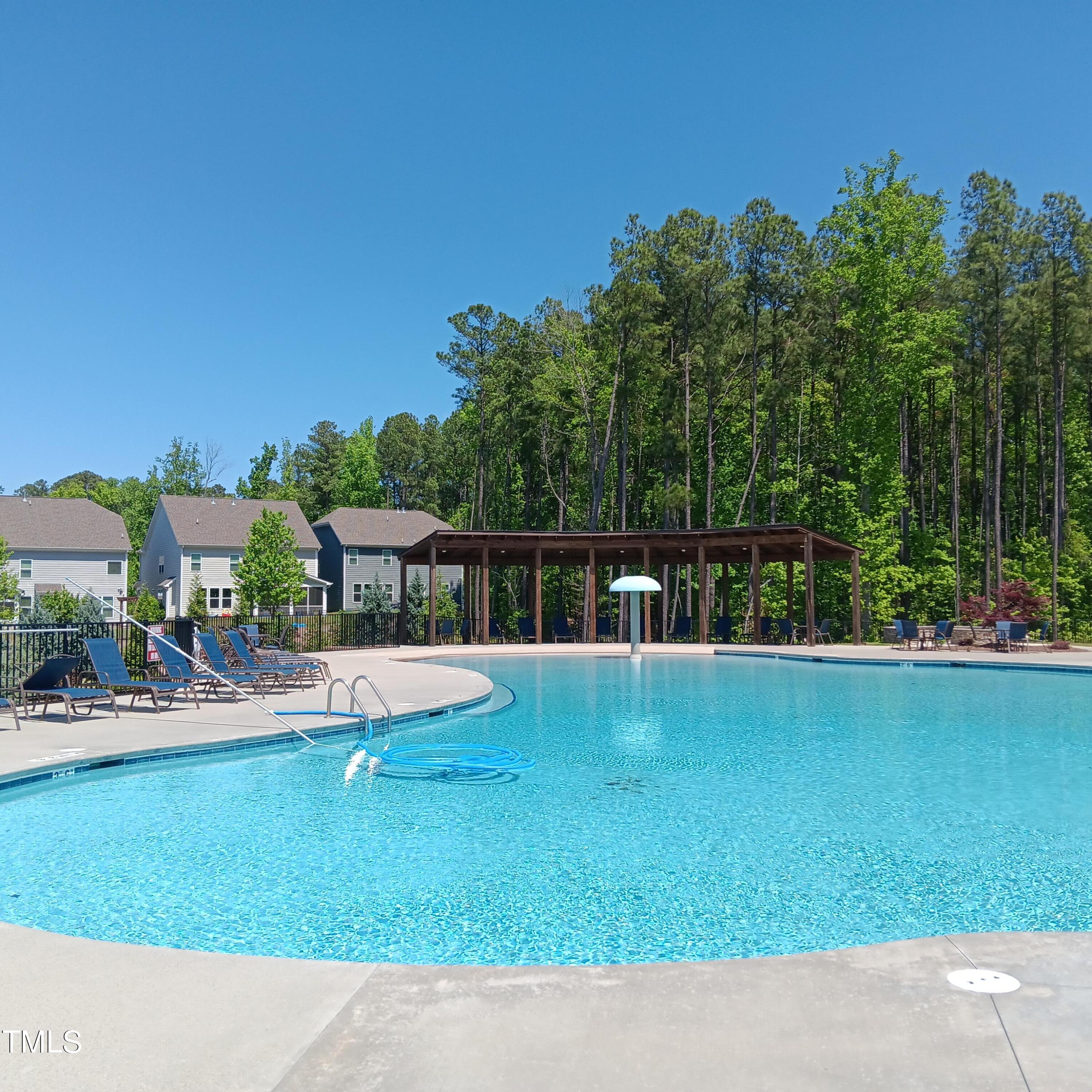 605 White Oak Pond Road Apex, NC 27523 - Photo 45 of 46 a aerial view of a house with swimming pool garden and patio