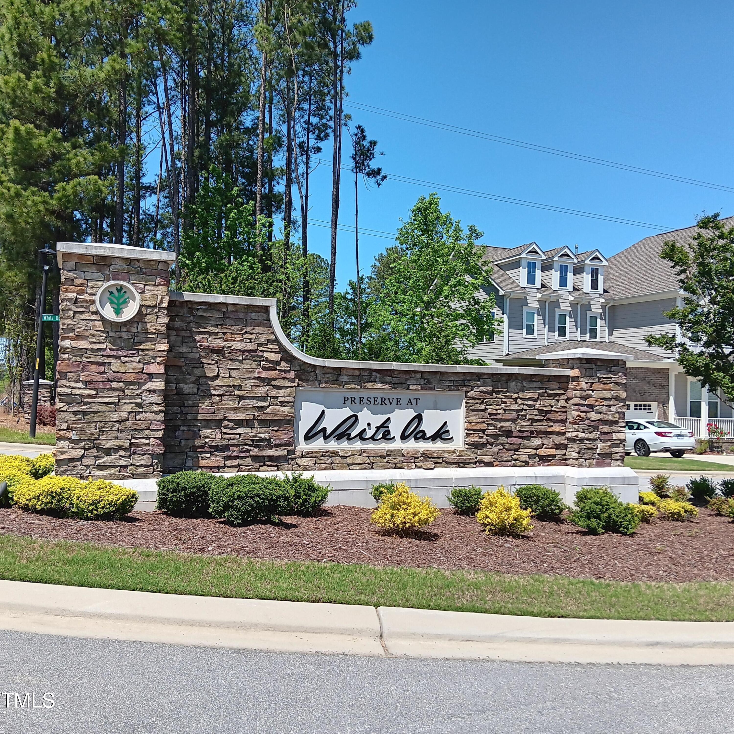 605 White Oak Pond Road Apex, NC 27523 - Photo 46 of 46 a view of a house with a yard and potted plants