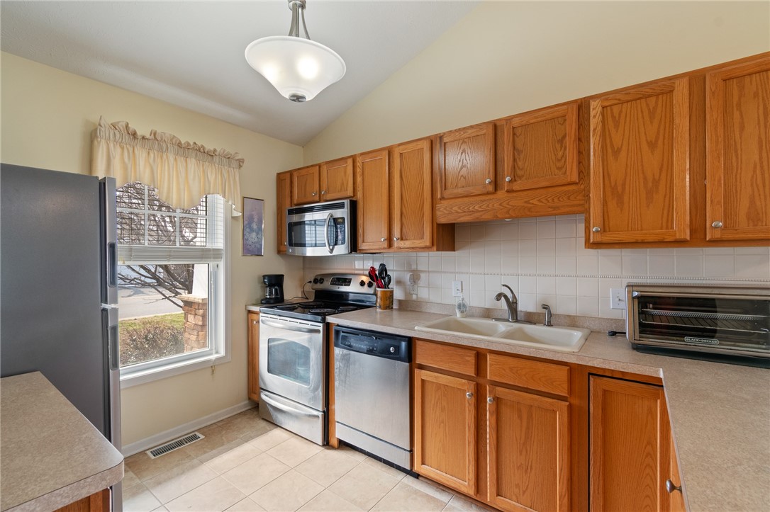10 Turtle Wood Trail Greece, NY 14626 - Photo 27 of 28 The tidy kitchen - open floor plan and a breakfast