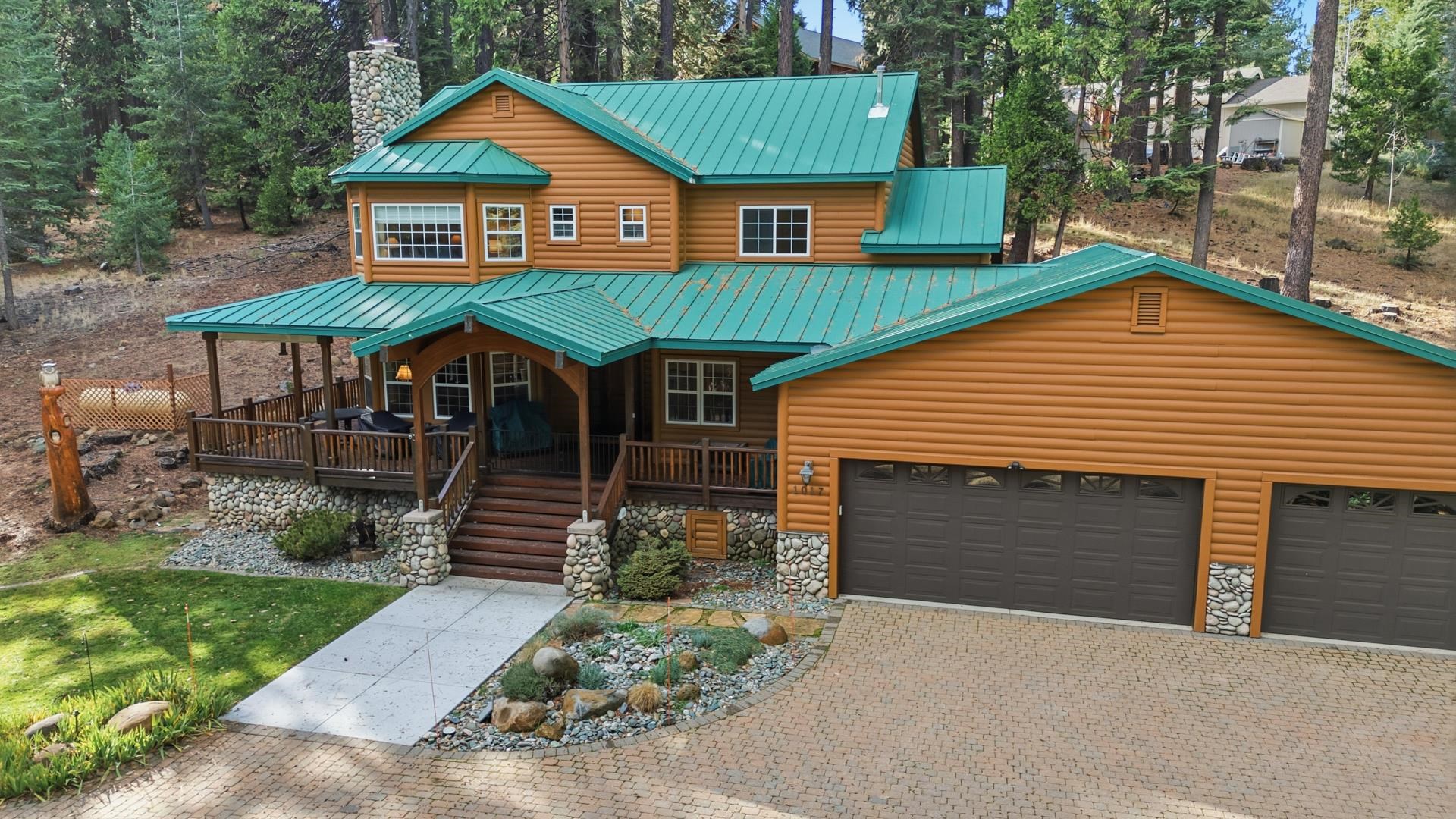 1017 Timber Ridge Road Lake Almanor, CA 96137 - Photo 3 of 45 a front view of a house with garden
