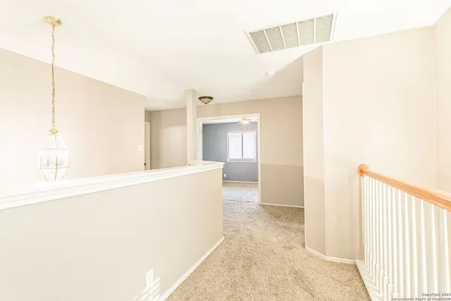 a view of balcony with wooden floor and seating space