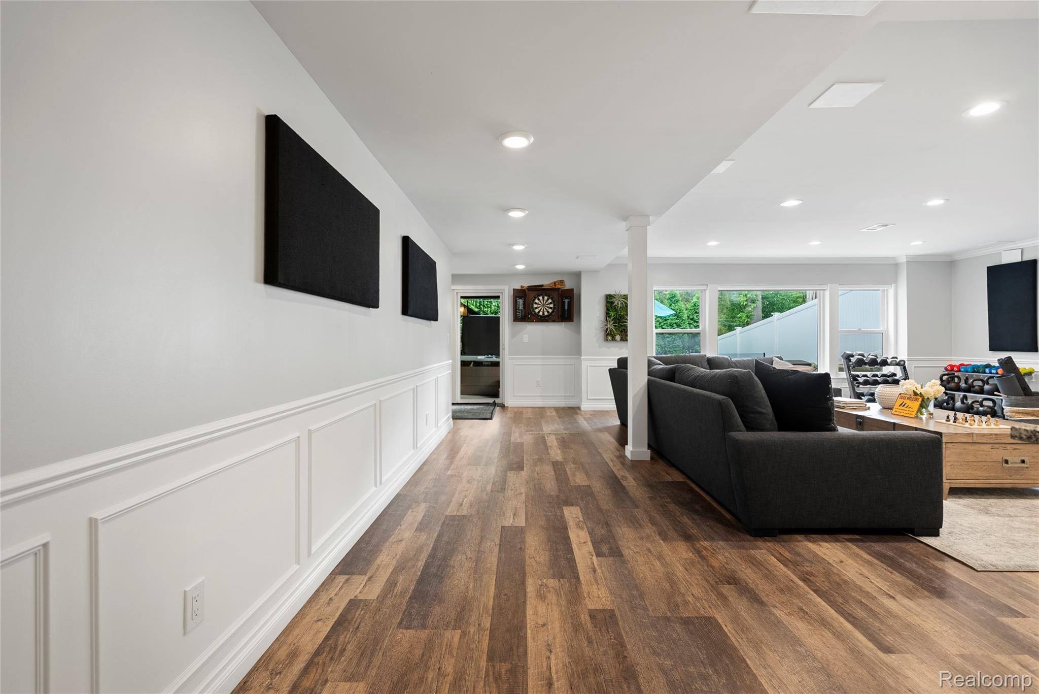 524 Ludlow Avenue Rochester, MI 48307 - Photo 23 of 36 Hallway featuring a decorative wall, a wainscoted wall, dark wood-style flooring, and recessed lighting