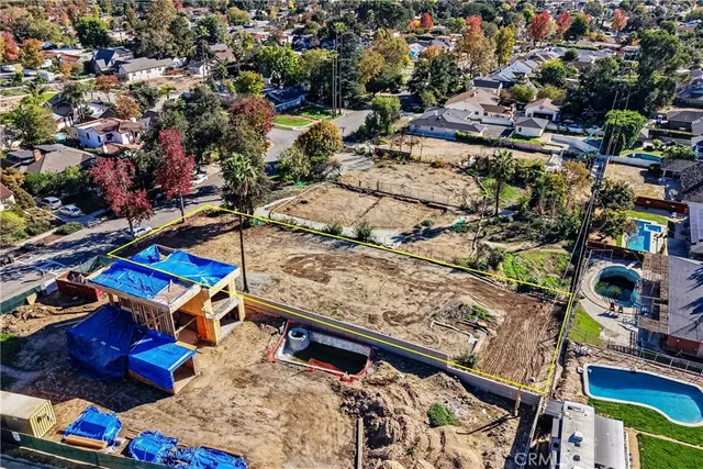 an aerial view of a houses with outdoor space