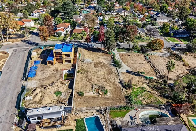 an aerial view of a houses with outdoor space