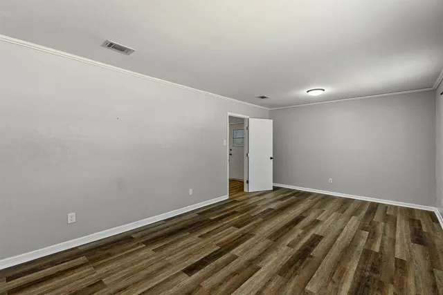 a view of room with wooden floor