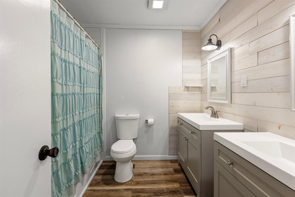 148 Royal Lane Commerce, TX 75428 - Photo 14 of 38 a bathroom with a sink toilet and shower