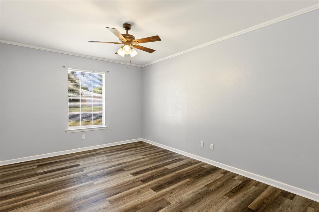 148 Royal Lane Commerce, TX 75428 - Photo 15 of 38 a view of a room with window and ceiling fan