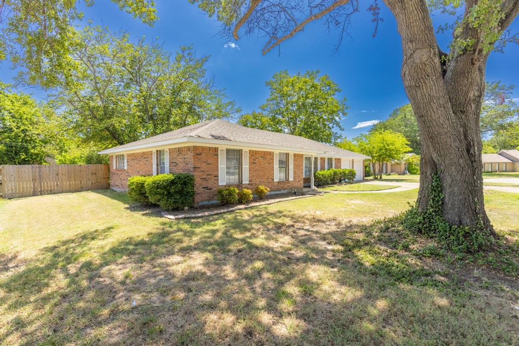 148 Royal Lane Commerce, TX 75428 - Photo 28 of 38 a house view with a garden space