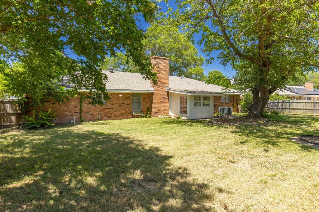148 Royal Lane Commerce, TX 75428 - Photo 31 of 38 a view of a house with a yard