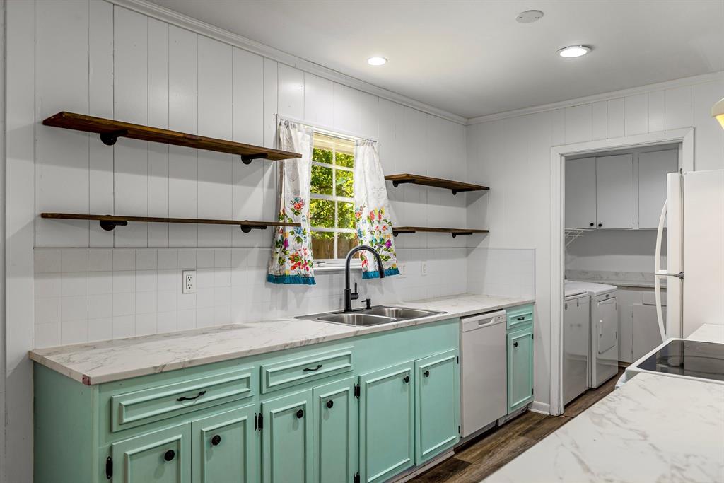 148 Royal Lane Commerce, TX 75428 - Photo 6 of 38 a kitchen with a sink cabinets and window