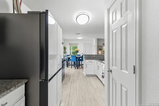 a view of a kitchen from the hallway