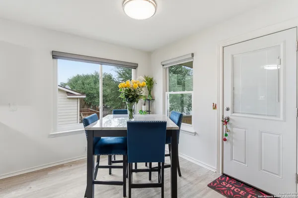 a dining room with furniture and window