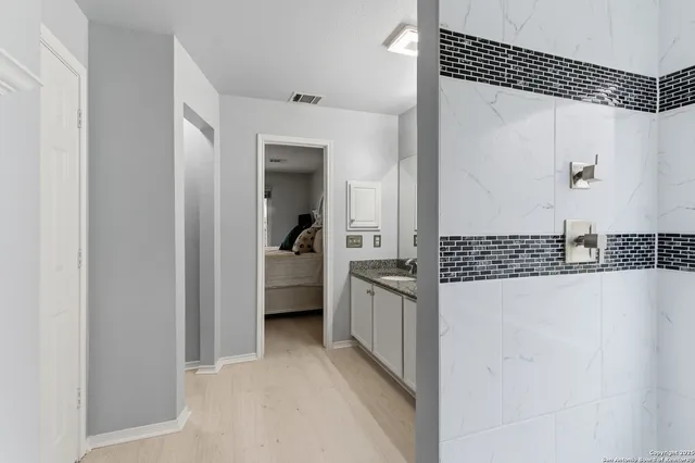 a view of a walk in closet and living room