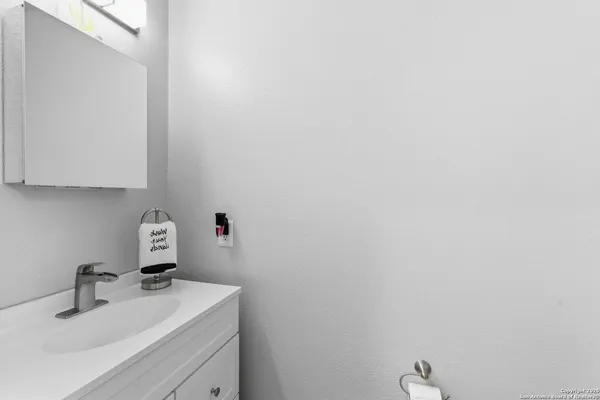 a bathroom with a sink and vanity