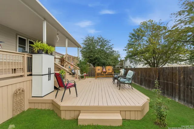 a view of backyard with a patio and outdoor seating
