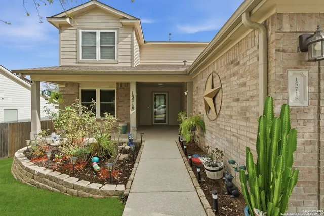 a front view of a house with garden