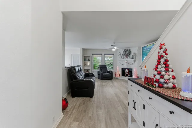a living room with furniture and flowers