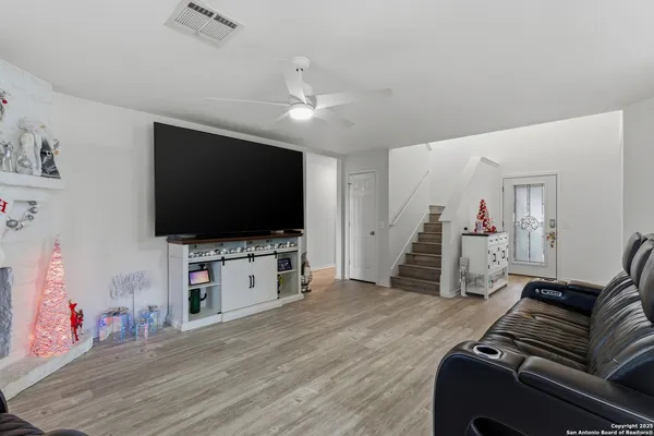 a living room with furniture and a flat screen tv