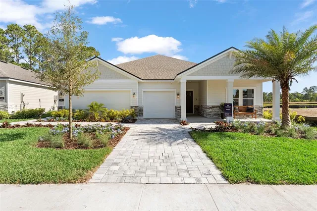 a view of a yard and front view of a house