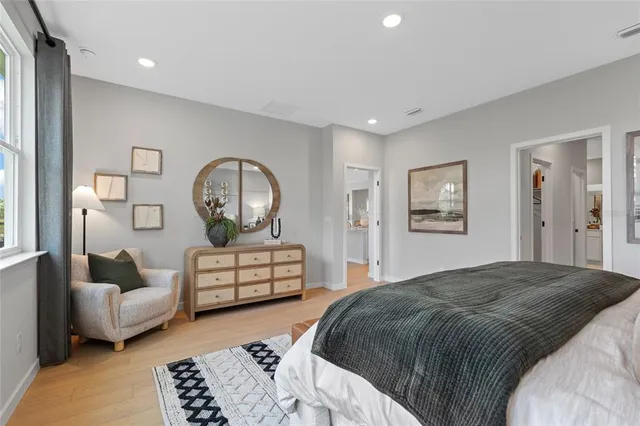 a bed room with a bed and a window