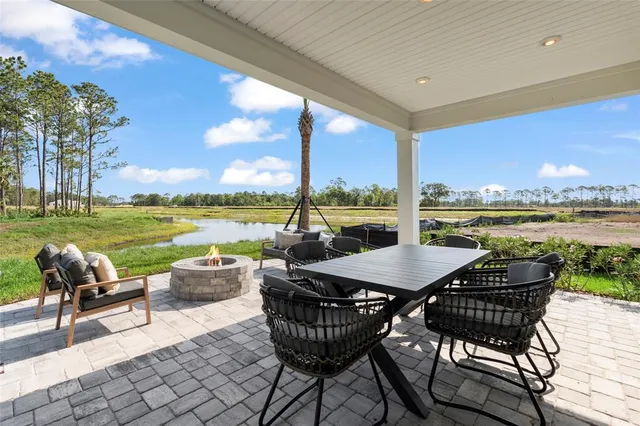a living room with fireplace furniture and a flat screen tv