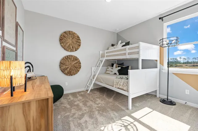 a bed room with a bed and a window