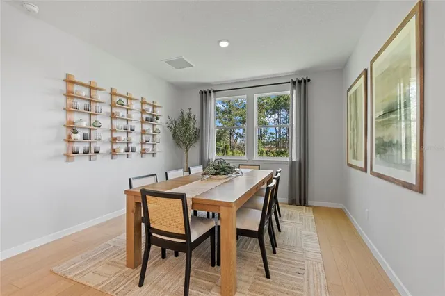 a view of a house with backyard porch and sitting area