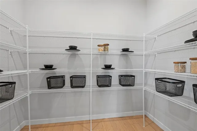 a kitchen with a sink a stove and cabinets