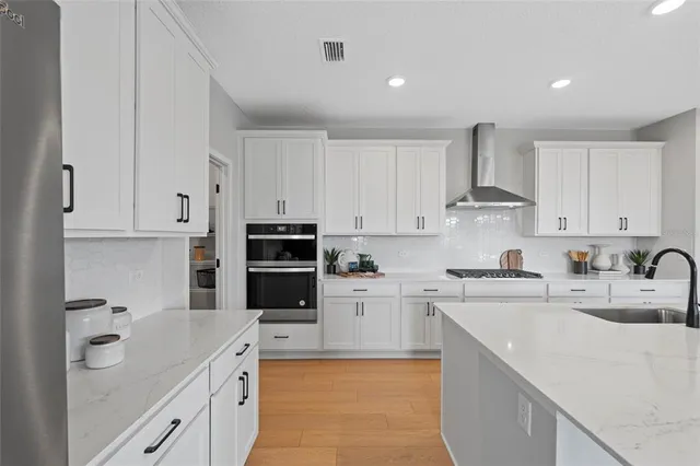 a view of wooden door and an empty room