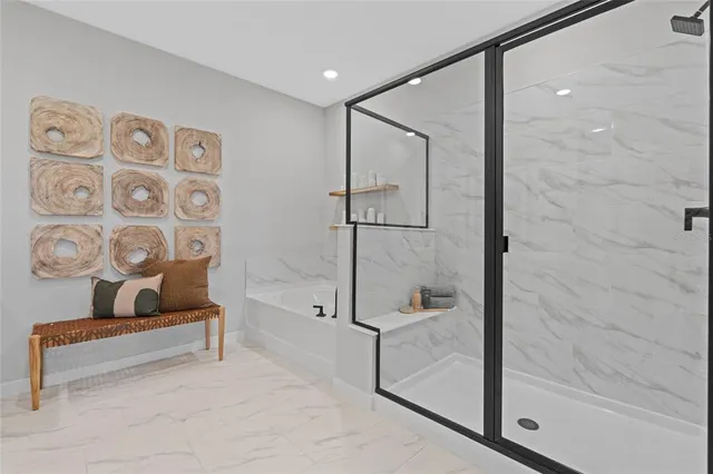 a bathroom with a bathtub and a shower
