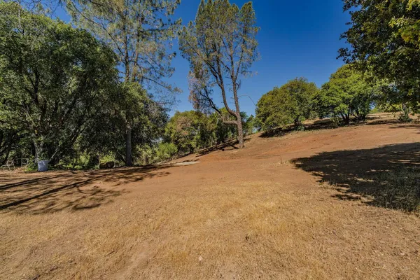 a view of a backyard of a house