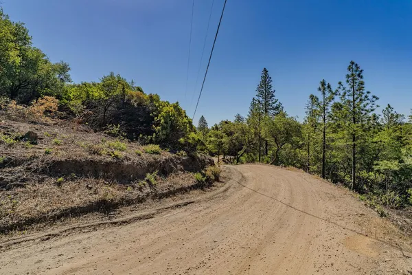 a view of a road with a building in the background