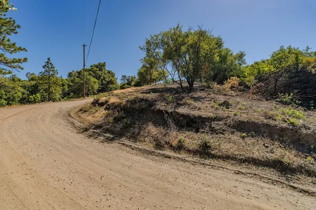 a view of a road with a yard