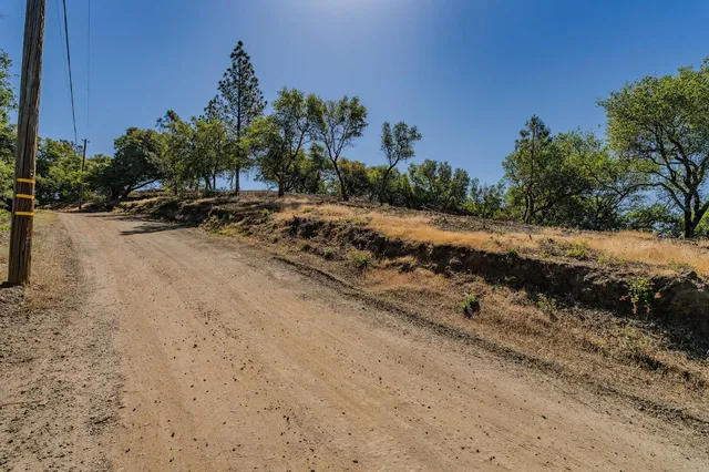 an aerial view of a houses with yard