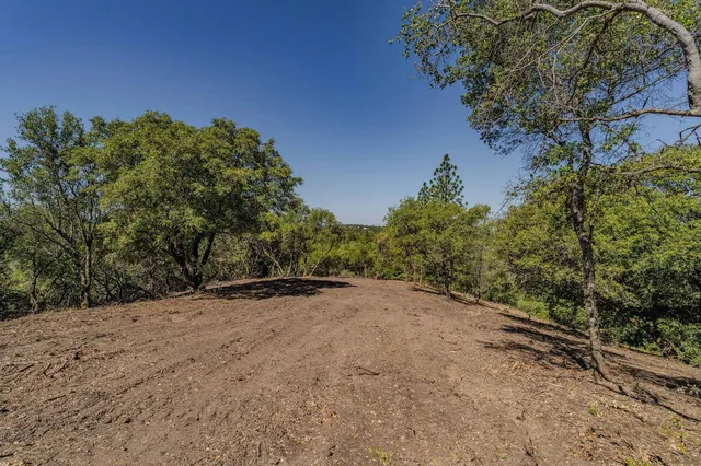 a view of a backyard of a house