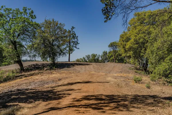 a view of a backyard of a house