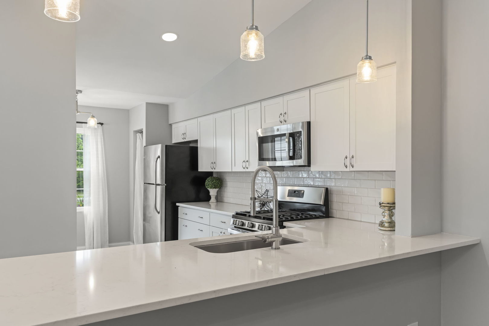 1802 77th Street Naperville, IL 60565 - Photo 11 of 29 a kitchen with stainless steel appliances a sink stove and refrigerator