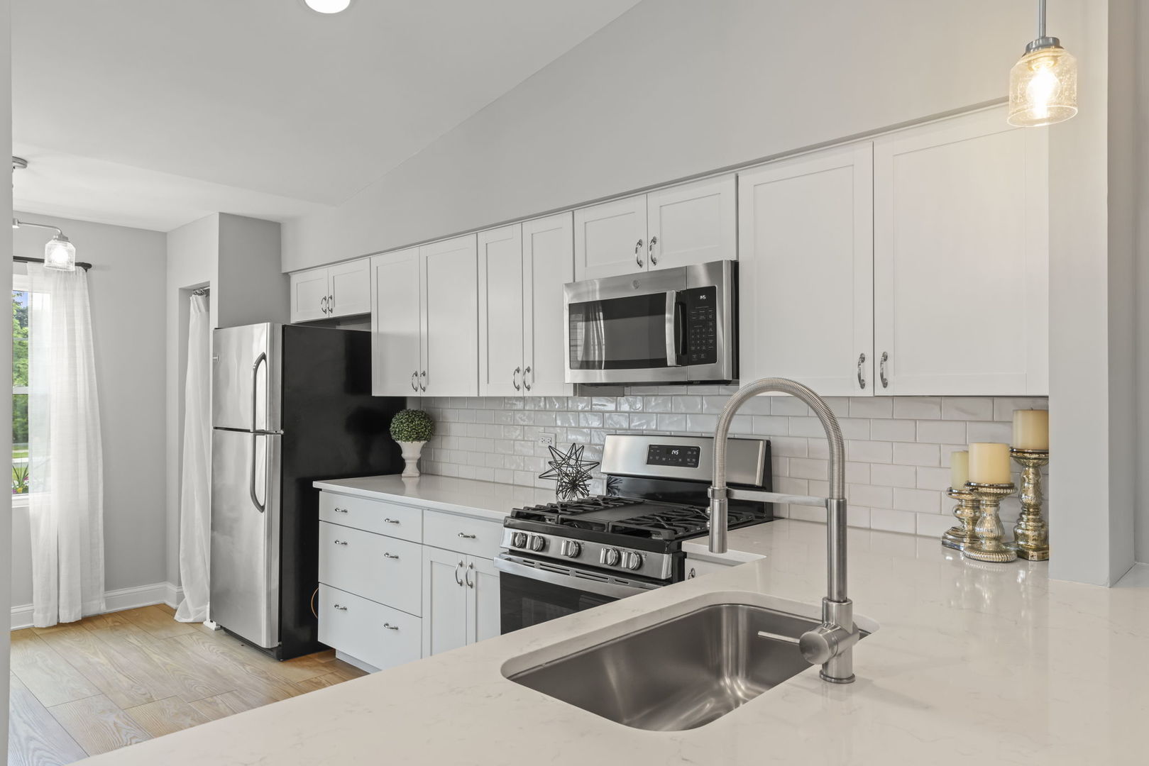 1802 77th Street Naperville, IL 60565 - Photo 12 of 29 a kitchen with stainless steel appliances a refrigerator sink and microwave
