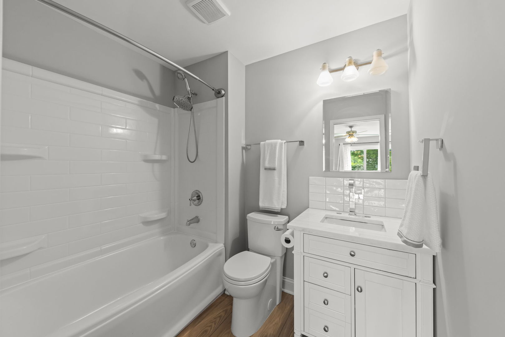 1802 77th Street Naperville, IL 60565 - Photo 19 of 29 a bathroom with a sink toilet vanity and shower