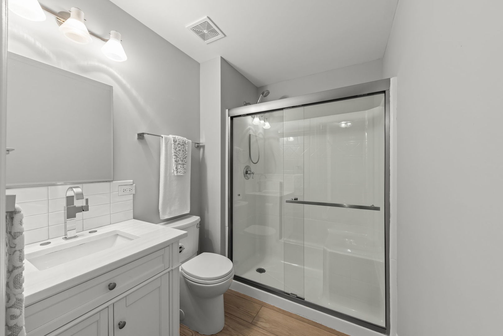 1802 77th Street Naperville, IL 60565 - Photo 23 of 29 a bathroom with a granite countertop sink toilet and shower