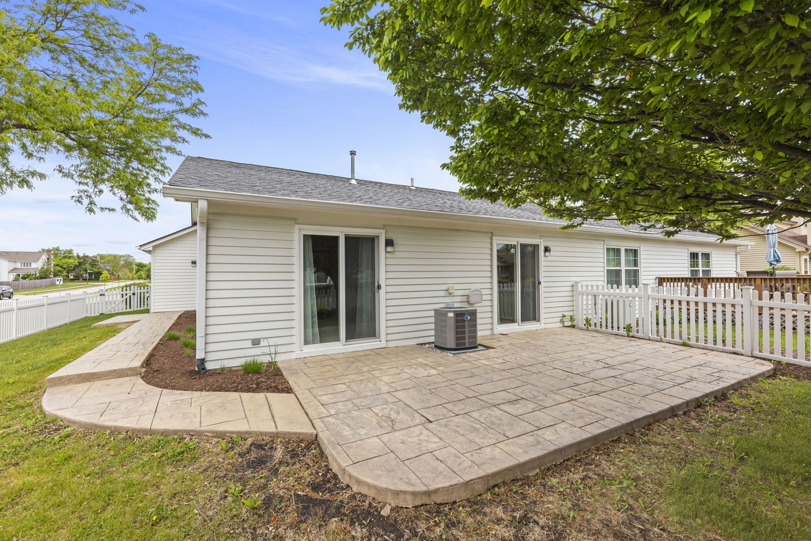 1802 77th Street Naperville, IL 60565 - Photo 25 of 29 a view of a house with backyard and a tree