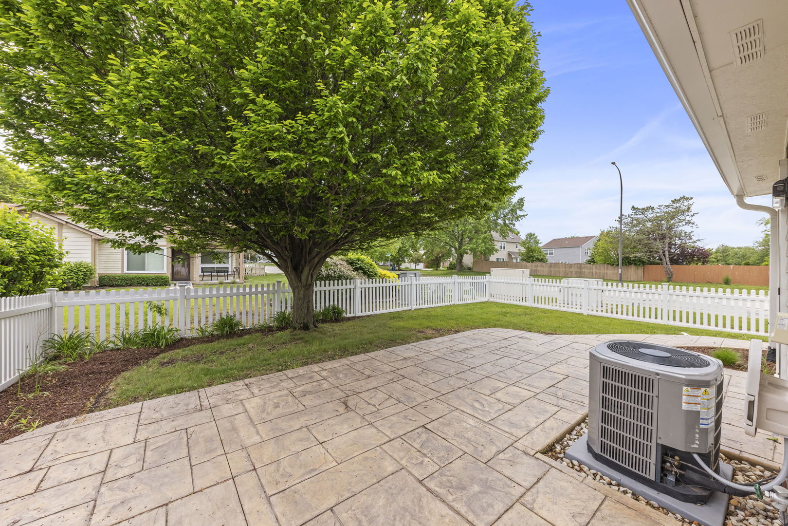 1802 77th Street Naperville, IL 60565 - Photo 26 of 29 a view of a house with a backyard