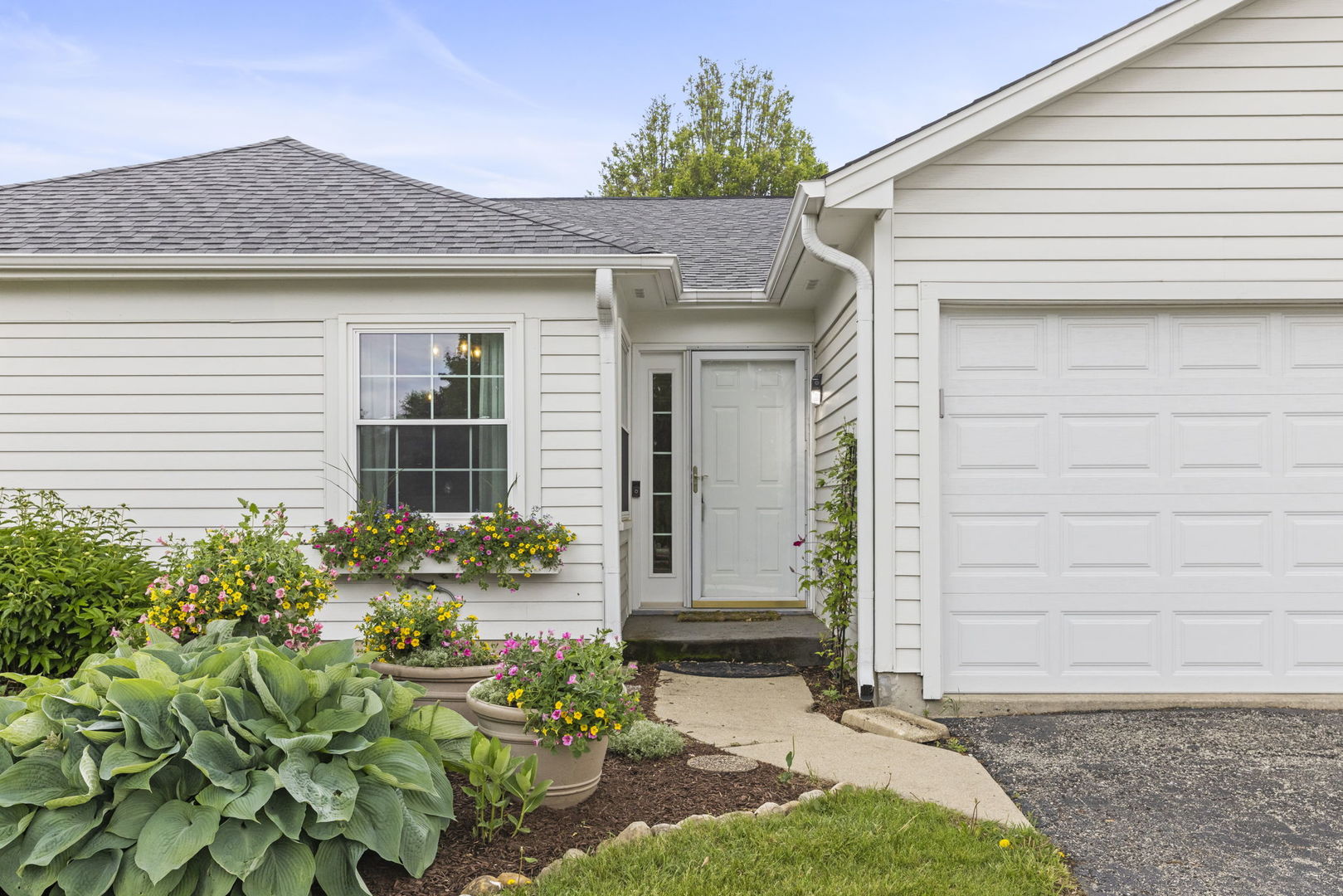 1802 77th Street Naperville, IL 60565 - Photo 3 of 29 a front view of a house with a yard