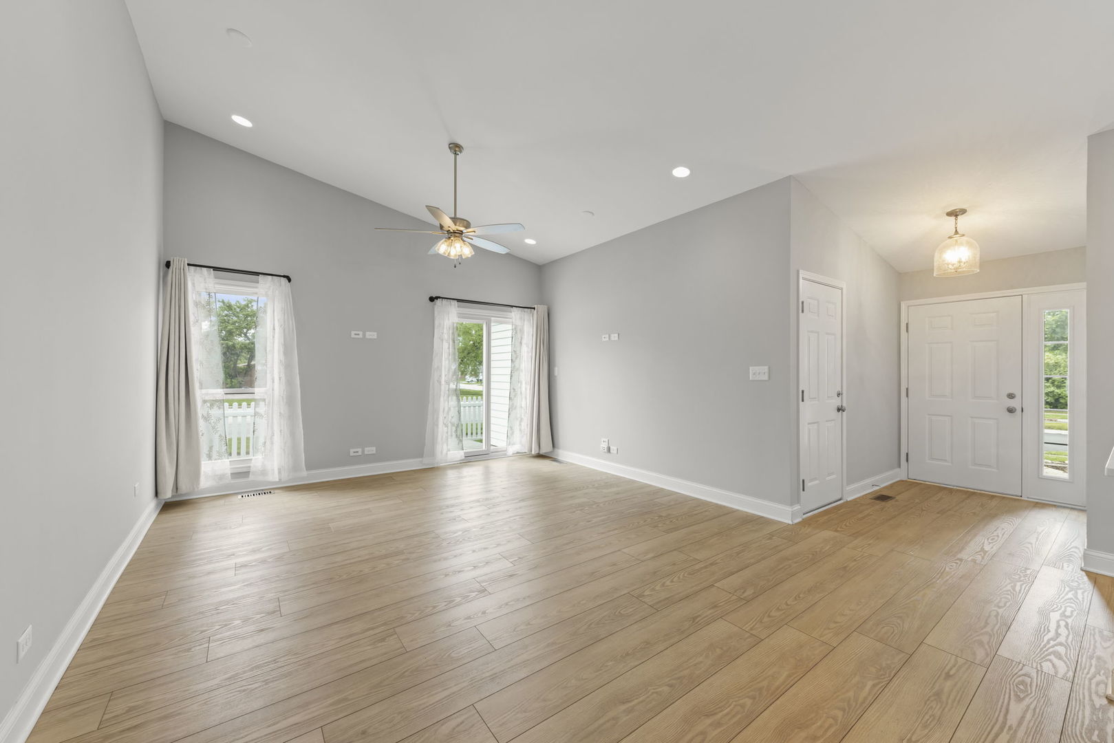 1802 77th Street Naperville, IL 60565 - Photo 5 of 29 an empty room with wooden floor and windows