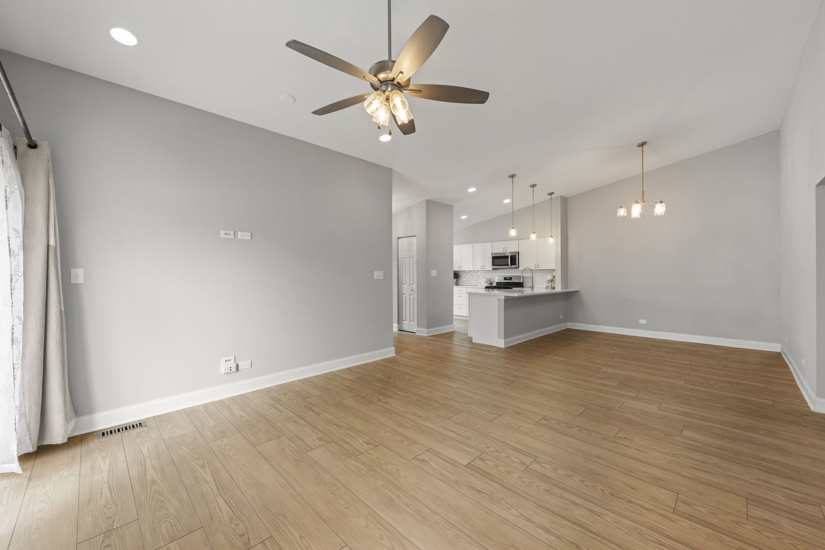 1802 77th Street Naperville, IL 60565 - Photo 6 of 29 a view of a kitchen with a sink and a refrigerator