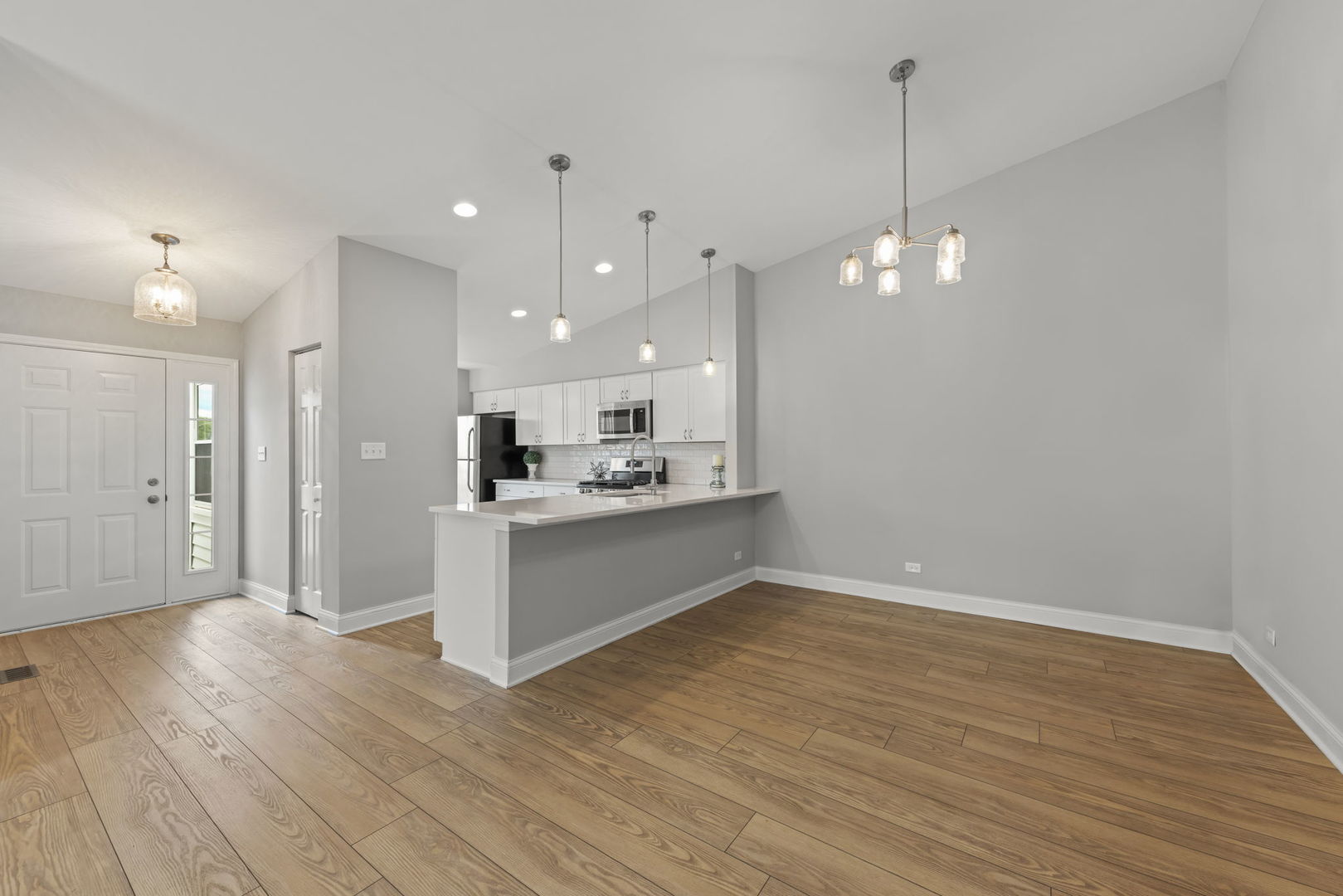 1802 77th Street Naperville, IL 60565 - Photo 7 of 29 a large kitchen with a lot of counter space and a refrigerator