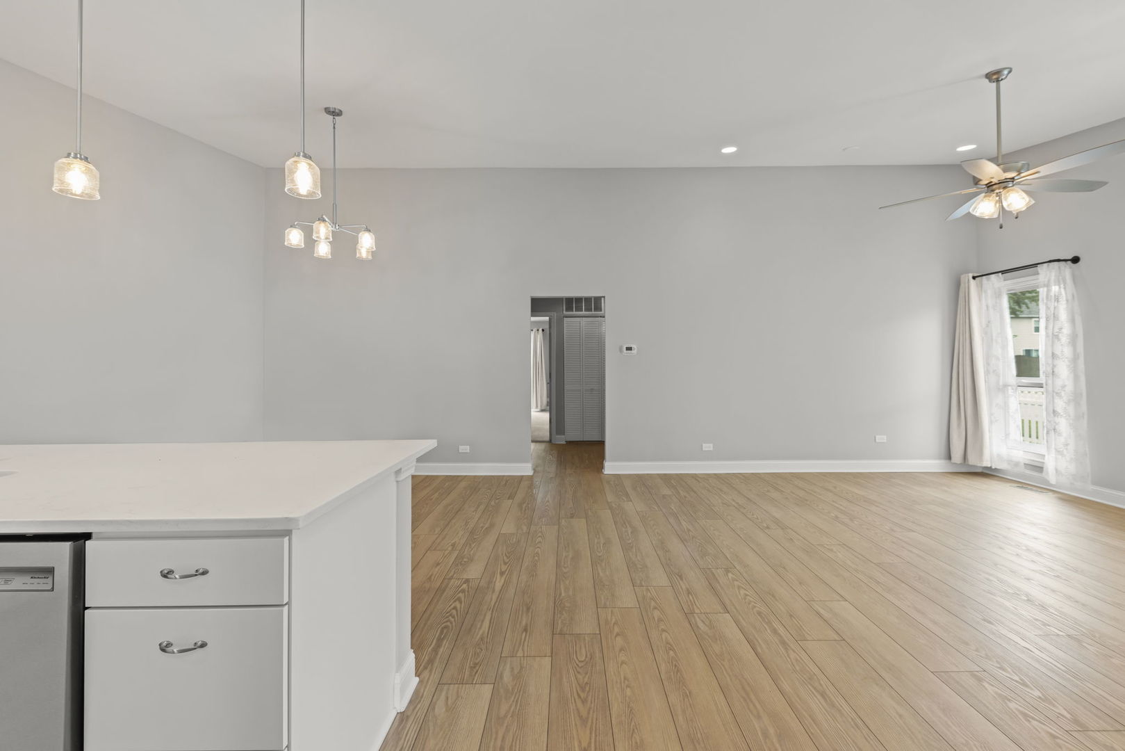 1802 77th Street Naperville, IL 60565 - Photo 8 of 29 a view of empty room with wooden floor and ceiling fan