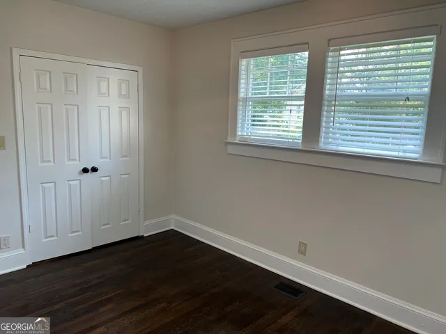 a bathroom with a toilet and a bathtub
