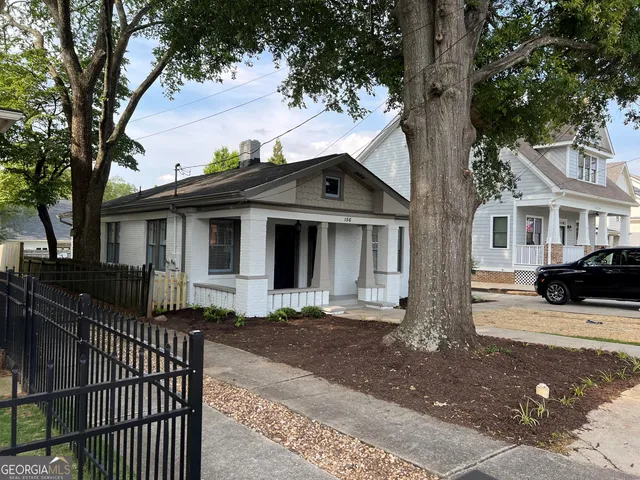 a front view of a house with yard