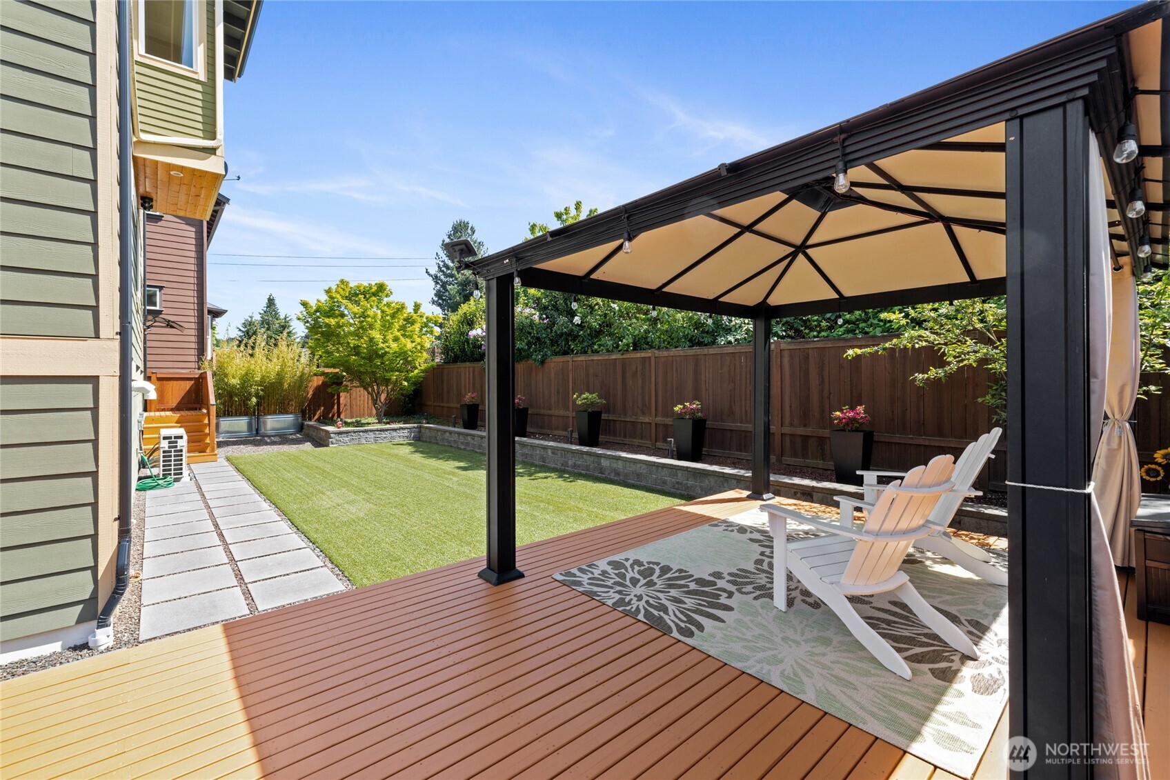 1409 Shattuck Avenue South Renton, WA 98055 - Photo 30 of 37 a view of a patio with a table chairs and a backyard